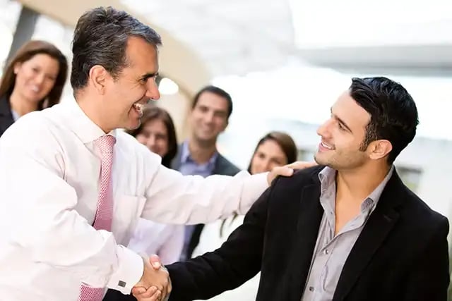 Business men closing deal with a handshake-1