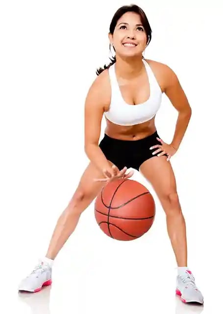 Female basketball player bouncing the ball