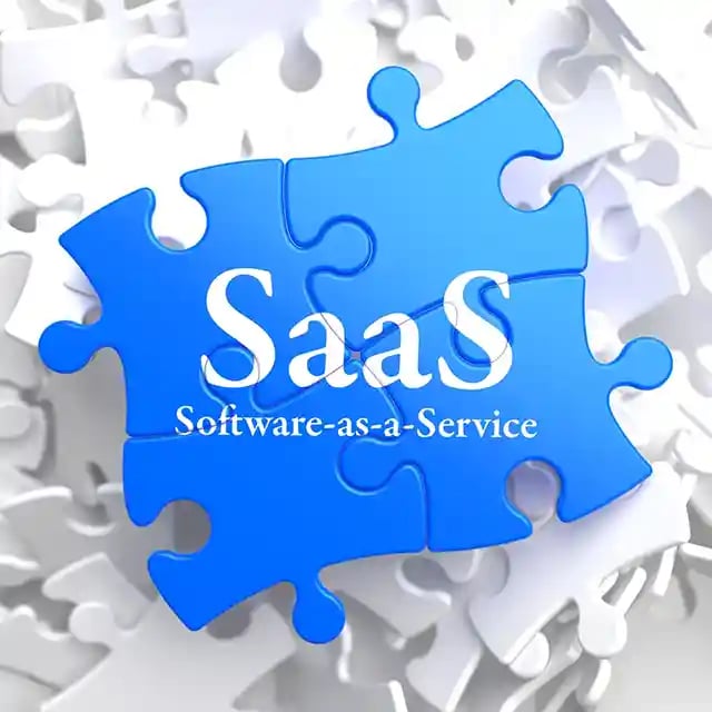 SAAS - Software-as-a-Service - Written on Blue Puzzle Pieces