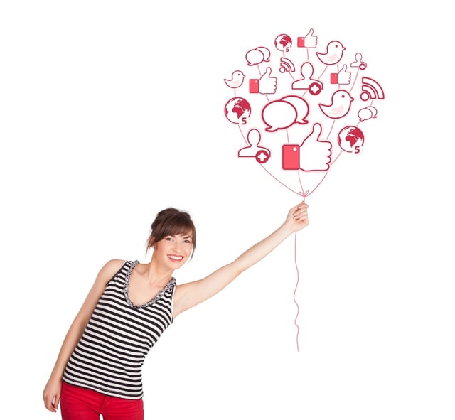 Social traffic shown by a happy young lady holding social icon balloon