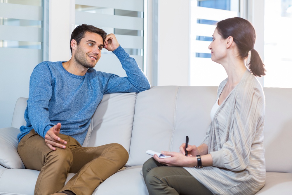 Marketing consultant talking with happy client in the office