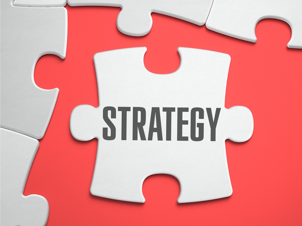PPC Strategy - Text on Puzzle on the Place of Missing Pieces. Scarlett Background. Close-up. 3d Illustration.
