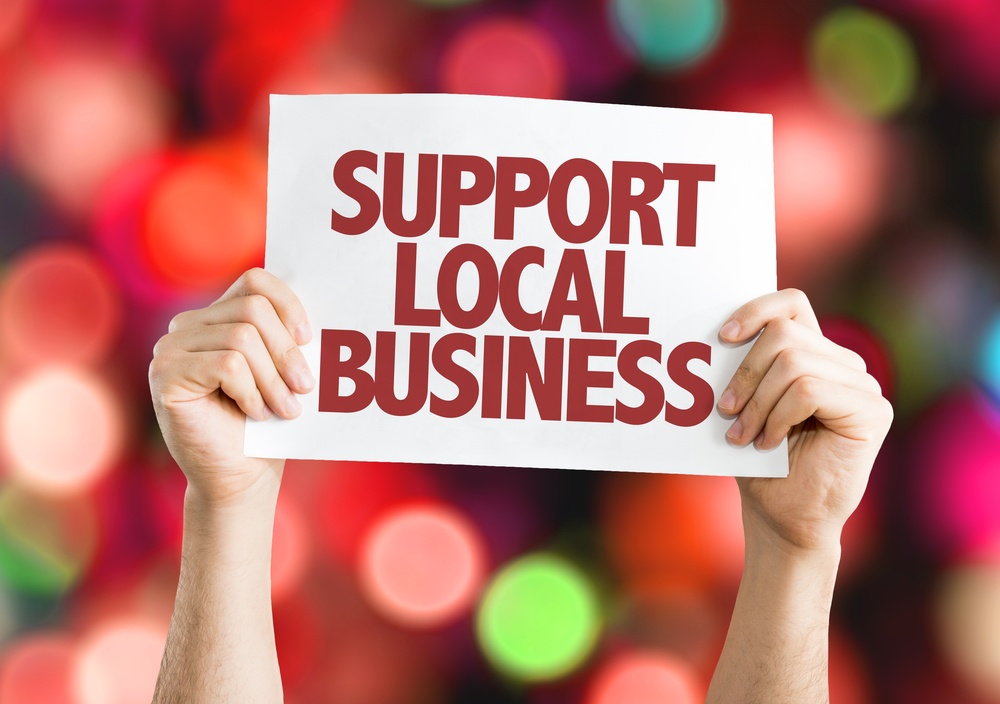 Support Local Dentist placard with bokeh background