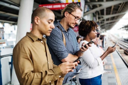 Three people on their phones