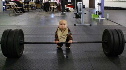 baby lifting large weight 